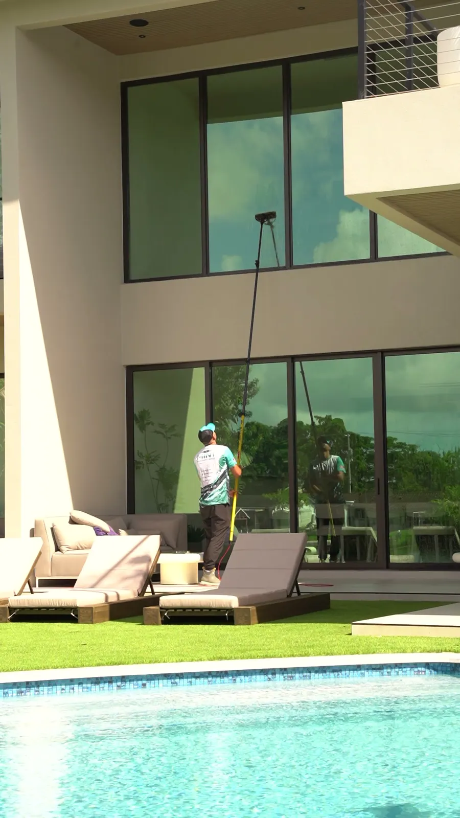 Window cleaning at a pool home
